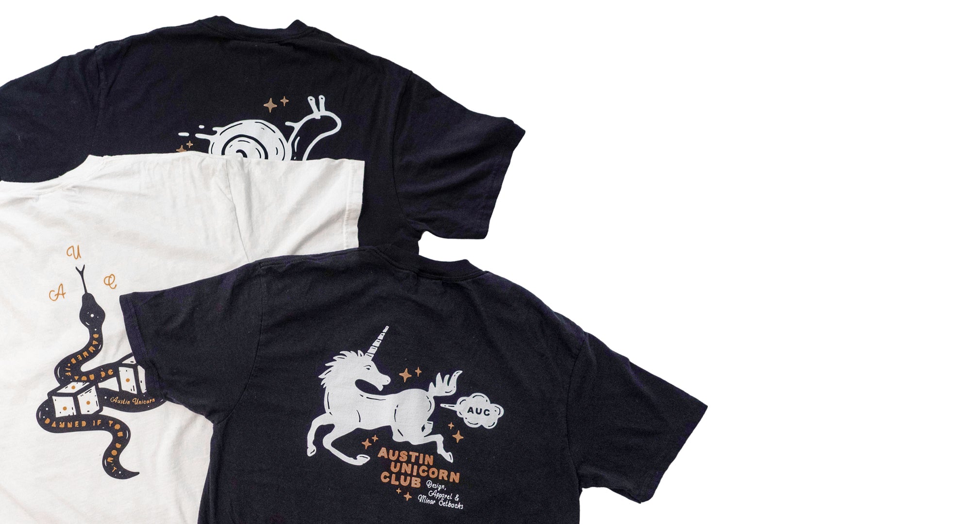 Three Austin Unicorn Club t-shirts with custom designs on a white background