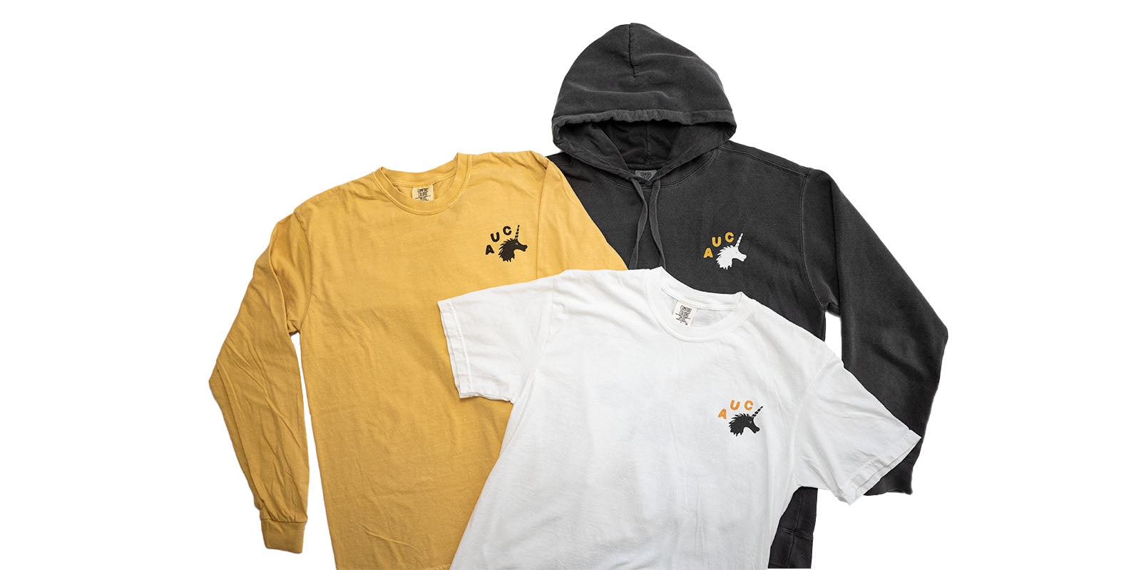 Three Austin Unicorn Club apparel items including a t-shirt, long sleeve tee, and heavyweight hoodie on a white background.