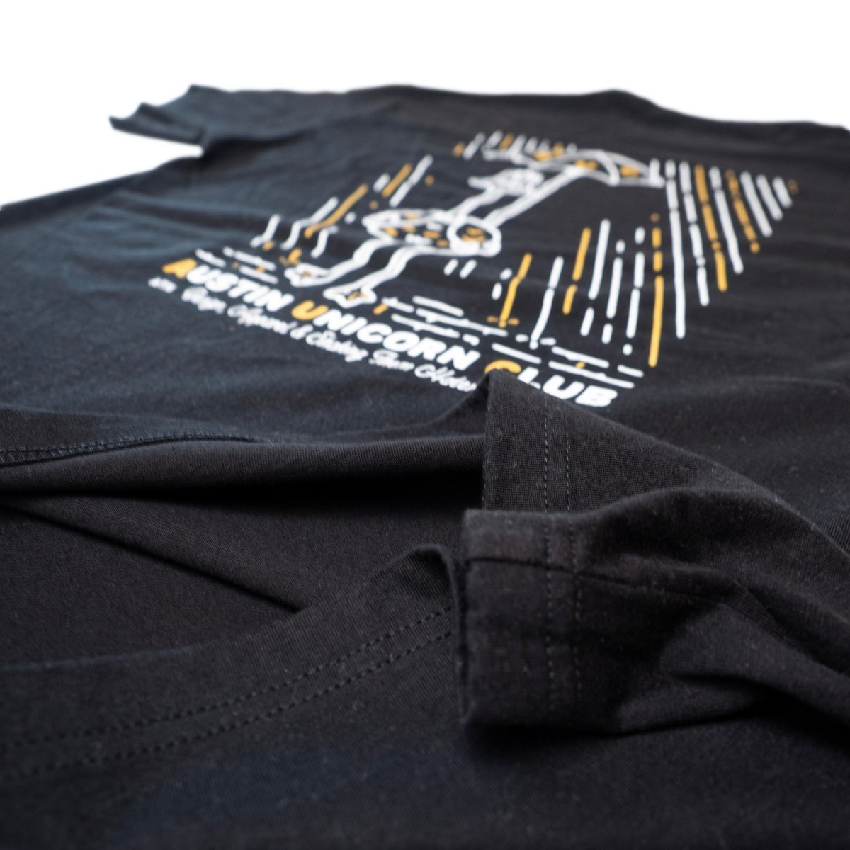 Shake Them Haters Off - Heavyweight Black Tee - Image of fabric material up close - Austin Unicorn Club Apparel